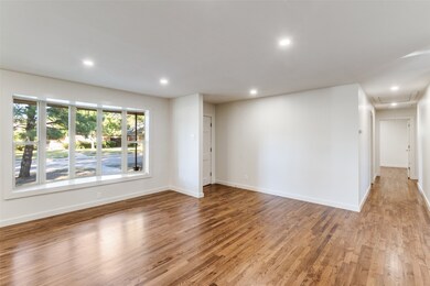 Large window makes this room bright, and welcoming.