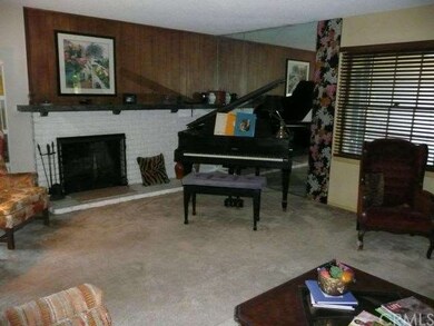 LIVING ROOM WITH GAS FIREPLACE.