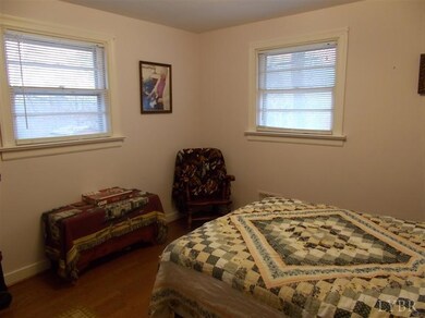 One of 2 bedrooms, also with hardwood floors.