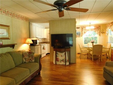 Main living area with view of dinette and kitchen and shows the nice flow.