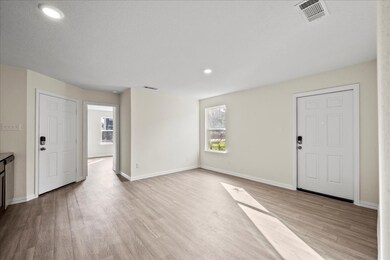 A view of the breakfast area and living room, both