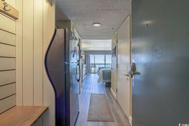 Corridor featuring light wood-type flooring and a 