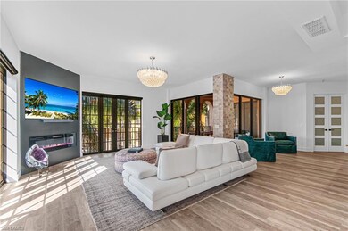 Living room, a notable chandelier, and visible ven