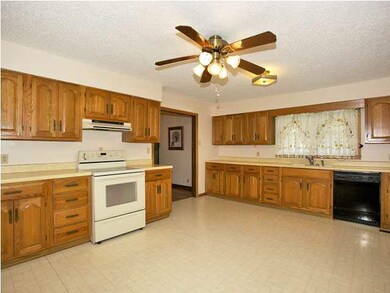 Huge kitchen with dishwasher, & stove.