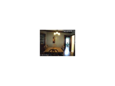 Built-in china cabinet & wood floor in dining room