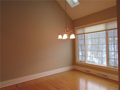 The rich hardwood floors and freshly painted neutr
