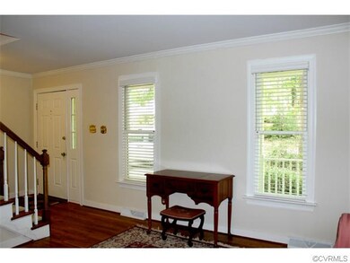 The foyers opens to the living room with hardwood 