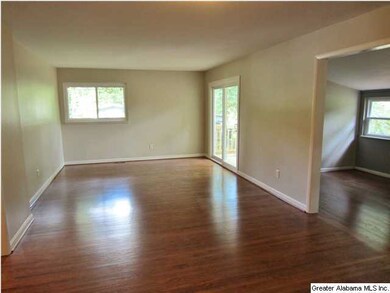 Sun-filled great room with refinished hardwood flo