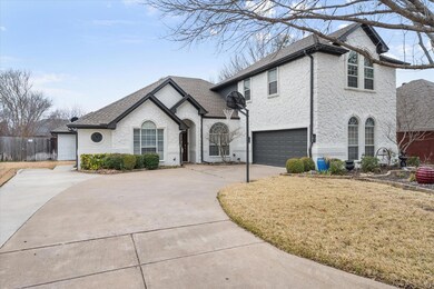 French country style house featuring a garage and 