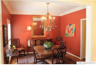 The Dining room also has crown molding, hardwood f