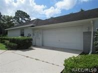 2-Car Side Entry Garage With Large Turn Pad.