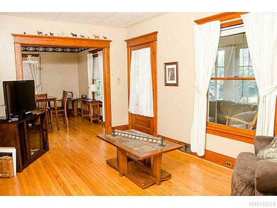 Living Room. Wood trim & hardwood floors in living