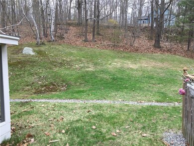 Slopped backyard gives you a private...
