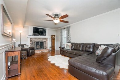 Family room with wood burning fireplace.