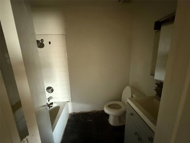 Full bath featuring toilet, vanity, and shower / b