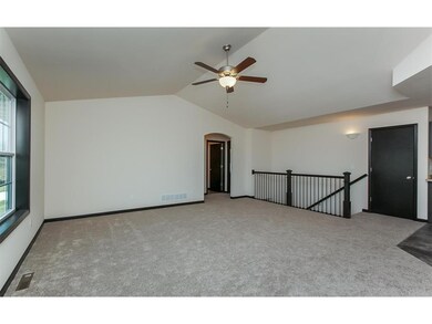 Side view of Great Room with hallway and stairway 