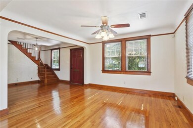 Facing entry way and stairs leading to primary suite