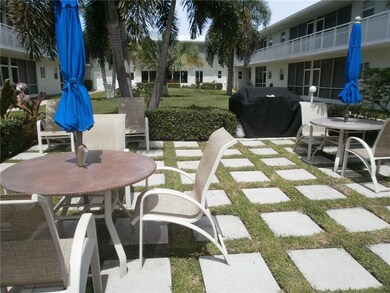 BBQ area adjacent to pool.
