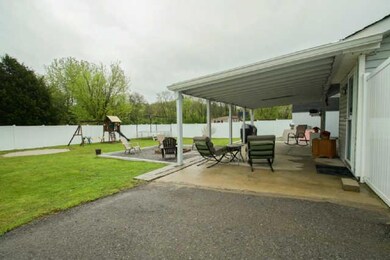 Sitting outside, watching family adventures or perhaps enjoying some quiet time, this covered patio is very inviting for all to enjoy!