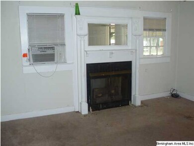 LIVING ROOM HAS OLD MANTEL