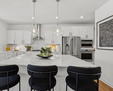 (Photo of model home, finishes will vary) With ample cabinetry storage, everything is kept both within reach and out of sight at the same time