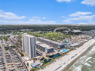 Bird's eye view of waterfront with a beach