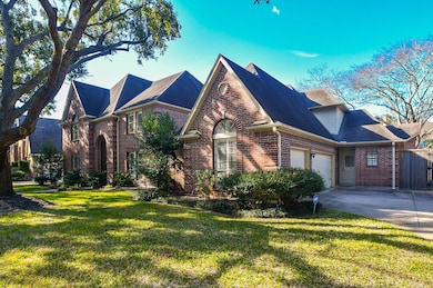 Side angle of the home showing 3 car garage.