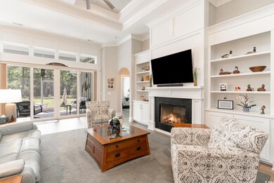 Living room with light wood-type flooring, a high 