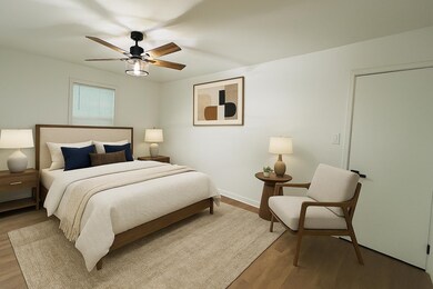 Bedroom with light wood-type flooring and a ceiling fan