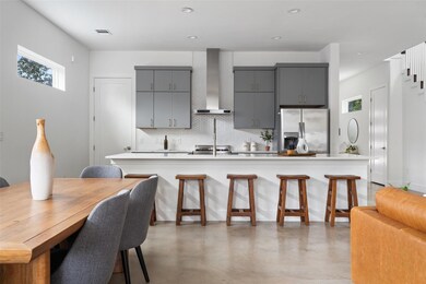 Kitchen with a healthy amount of sunlight, wall c