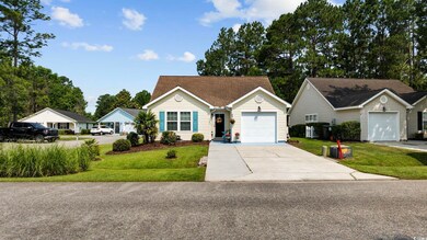 Ranch-style home with driveway, a front lawn, and a garage