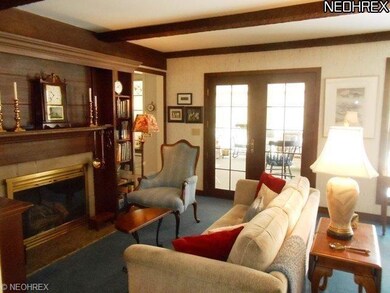 Handsome Den with fireplace.  Adjacent to the Kitc