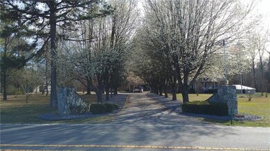 Stoned entrance to the property.  Beautiful trees 