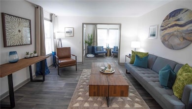 Living room featuring dark hardwood / wood-style f