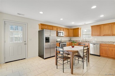 Kitchen with ceramic tile flooring, granite counte