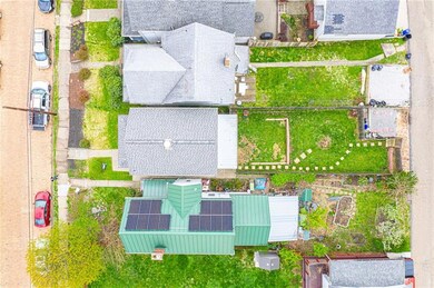 Aerial view of the house showing the new roof and 
