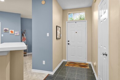 Half bath to the right and kitchen to the left