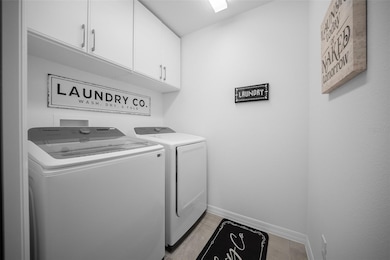 Indoor laundry with added cabinetry