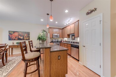 Kitchen work area with island with elevated bar he
