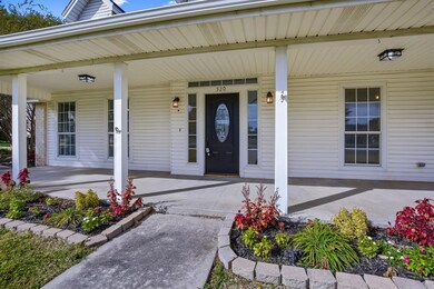Charming front porch to sit and relax and enjoy the country living.