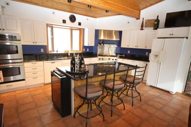 Spacious Kitchen with White Cabinets