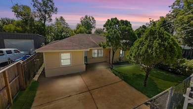 Charming single-story home with a paved driveway a