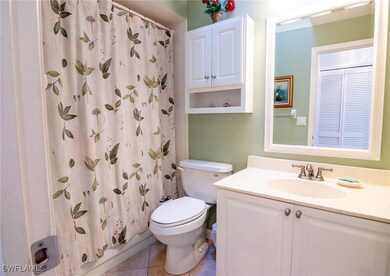 Bathroom with tile patterned flooring, vanity, and