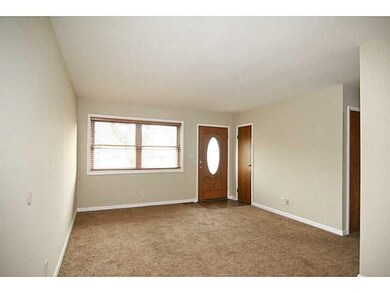 Living Room. Spacious living room with fresh new paint, new carpet, newer windows and real wood blinds.  Ready for you to move right in!