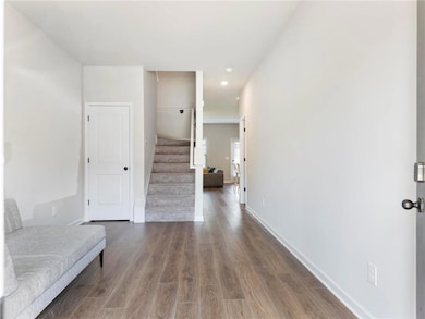 Foyer with wood-type flooring