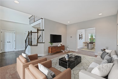 Living Room looking into dining room and two story