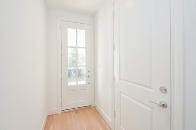 Light and bright entryway has access from front do