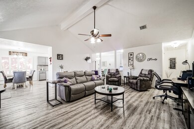 The family room seamlessly connects with the breakfast room, creating an inviting and open space.