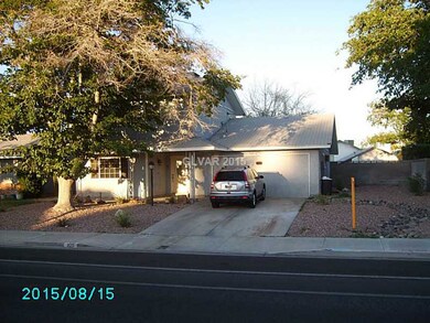 Facade/Exterior Front. Front of the home with RV/S