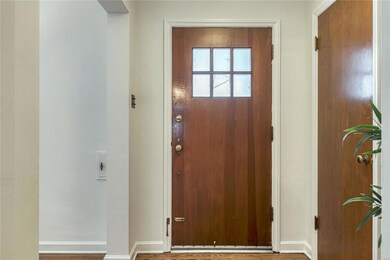 Front entry foyer picture. Glowing solid wood inte